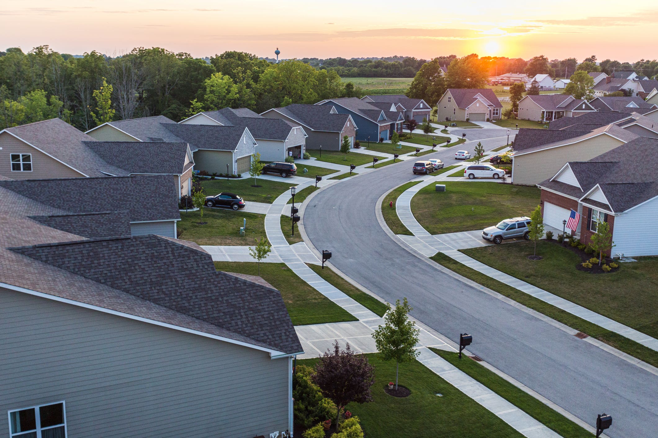 Aerial view of suburban neighborhood with dramatic sky