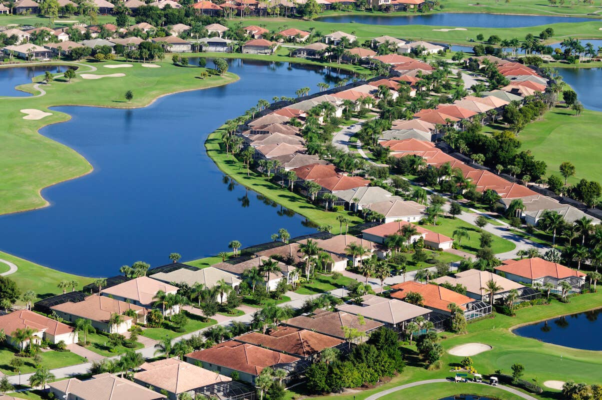 aerial view of a neighborhood near water