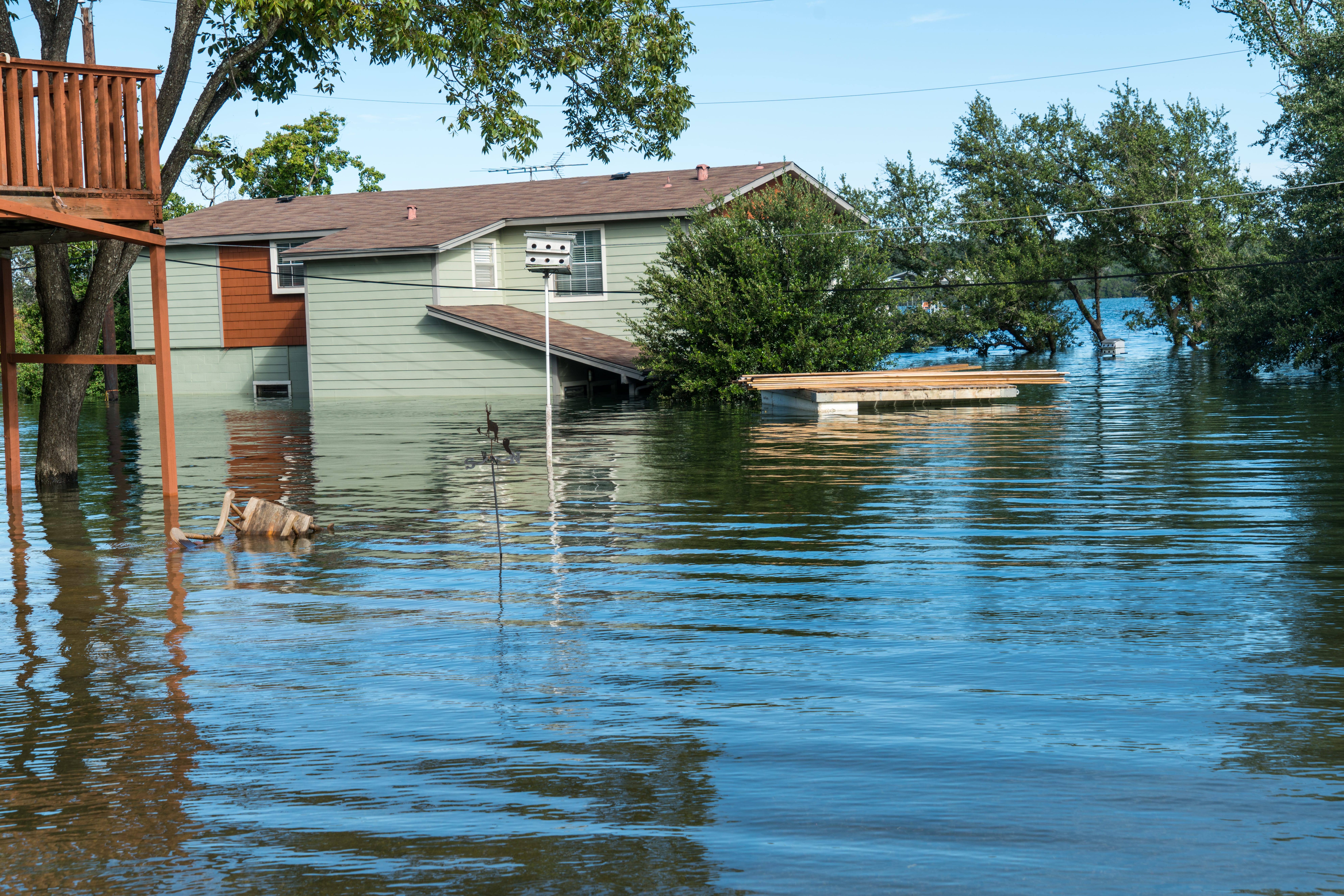 flood waters covering half a home