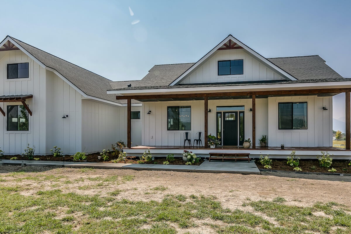 Modern white farmhouse with board-and-batten siding