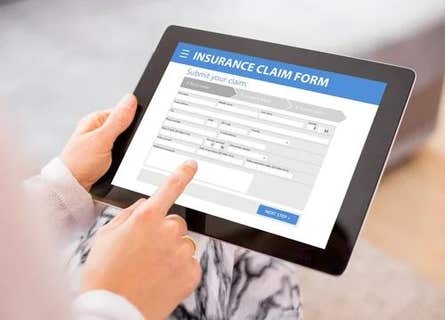 a tablet displaying a insurance claim form