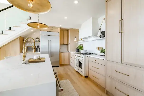 A renovated kitchen beside a staircase