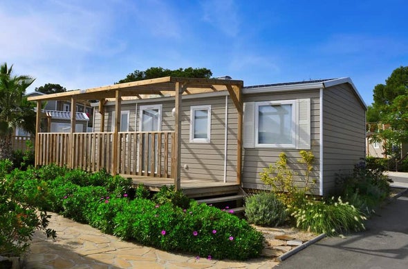 Mobile home with a wooden porch