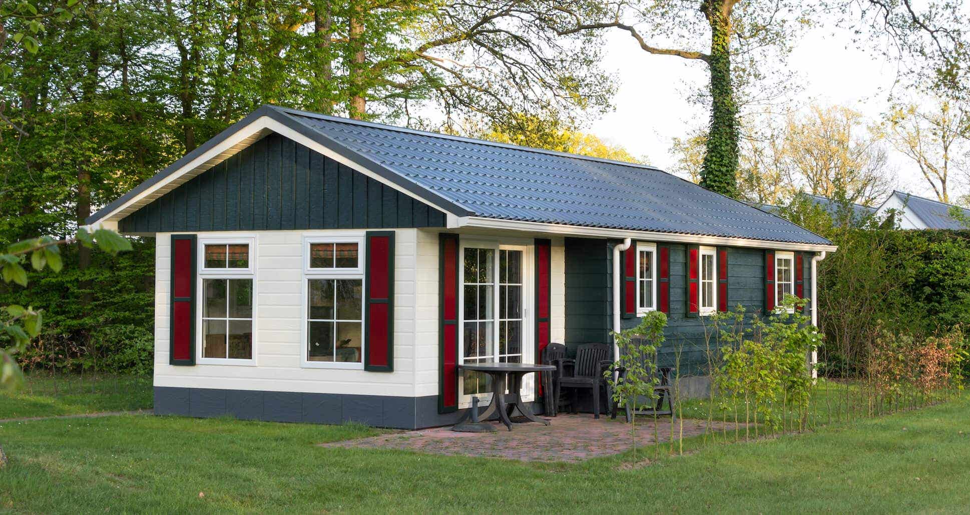 A cute gray, white and red modular home