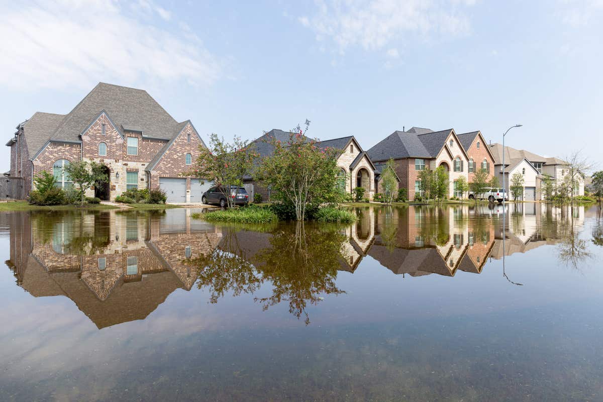 A suburban neighborhood surrounded by floodwaters