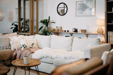 cozy living room with wooden furniture and an overstuffed white couch