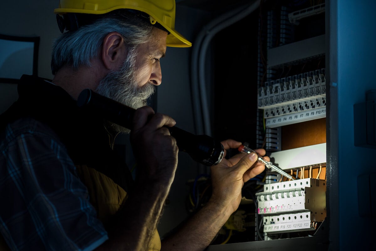 electrician working on an electrical panel