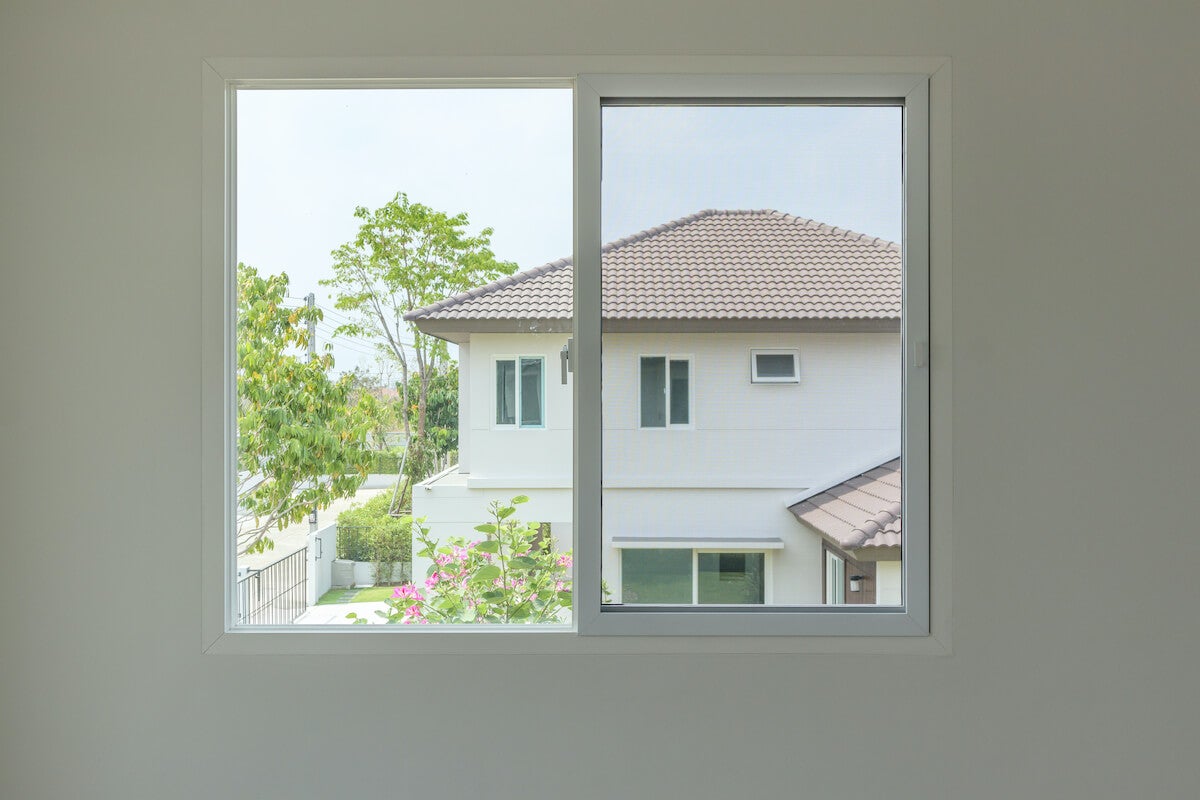 White wall with an open sliding window