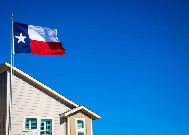 The Texas flag in front of a home