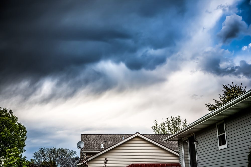 Homes under thunderstorm clouds
