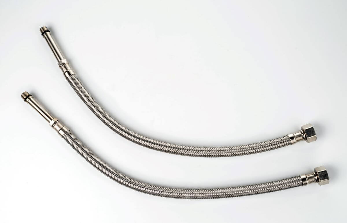 Two silver flexible connectors on a white background