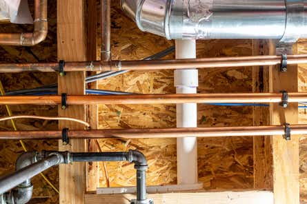 Pipes inside a wall of a home