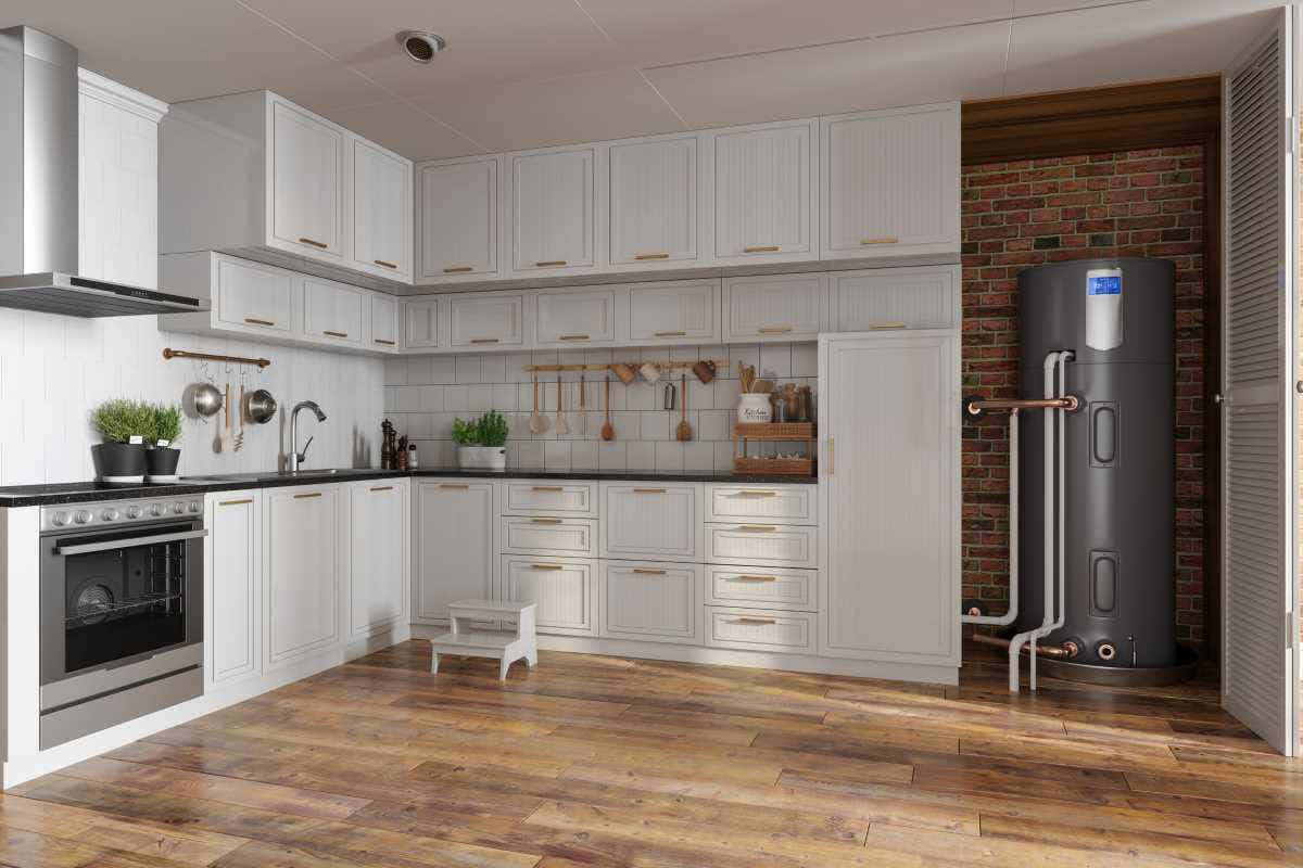 Kitchen interior with a stove, white cabinets, and electric boiler