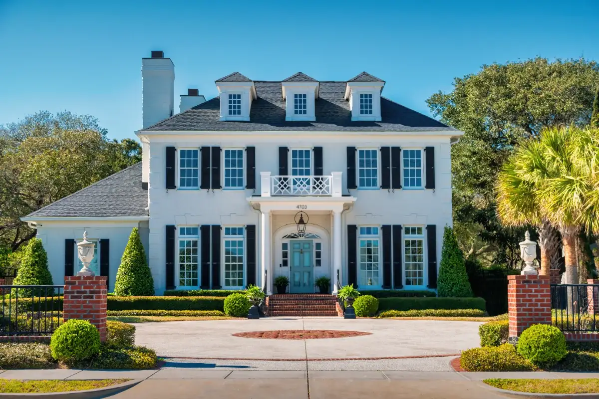 A white single-family home with a covered porch