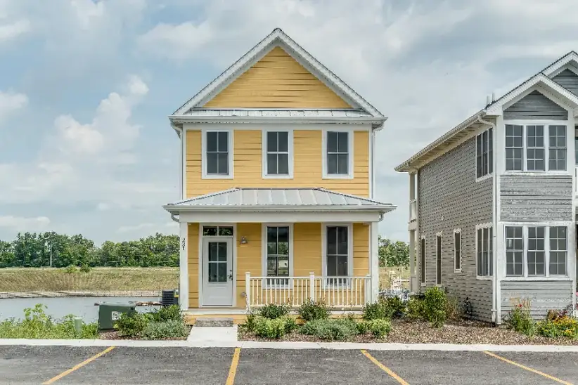 A yellow single-family home